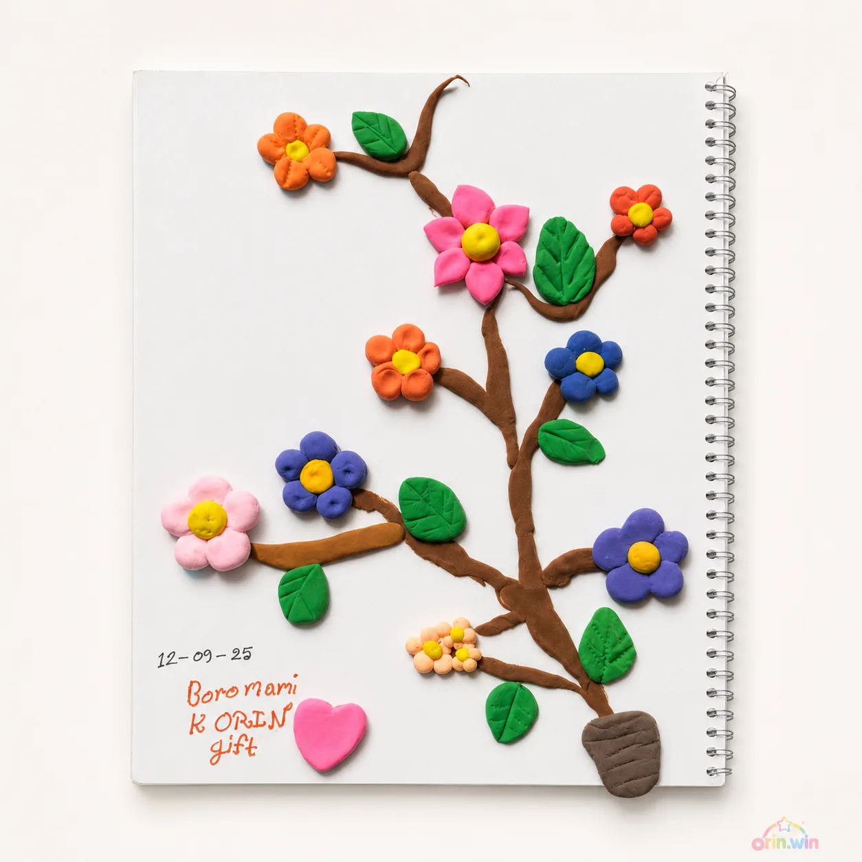 Orin's handmade flower tree craft card with colorful flowers and a heart.